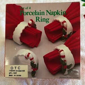 Set of four porcelain candy, cane napkin rings